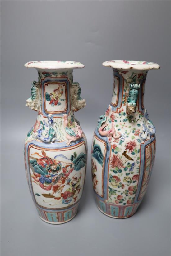 A pair of Chinese famille rose warrior vases, 19th century, height 26cm